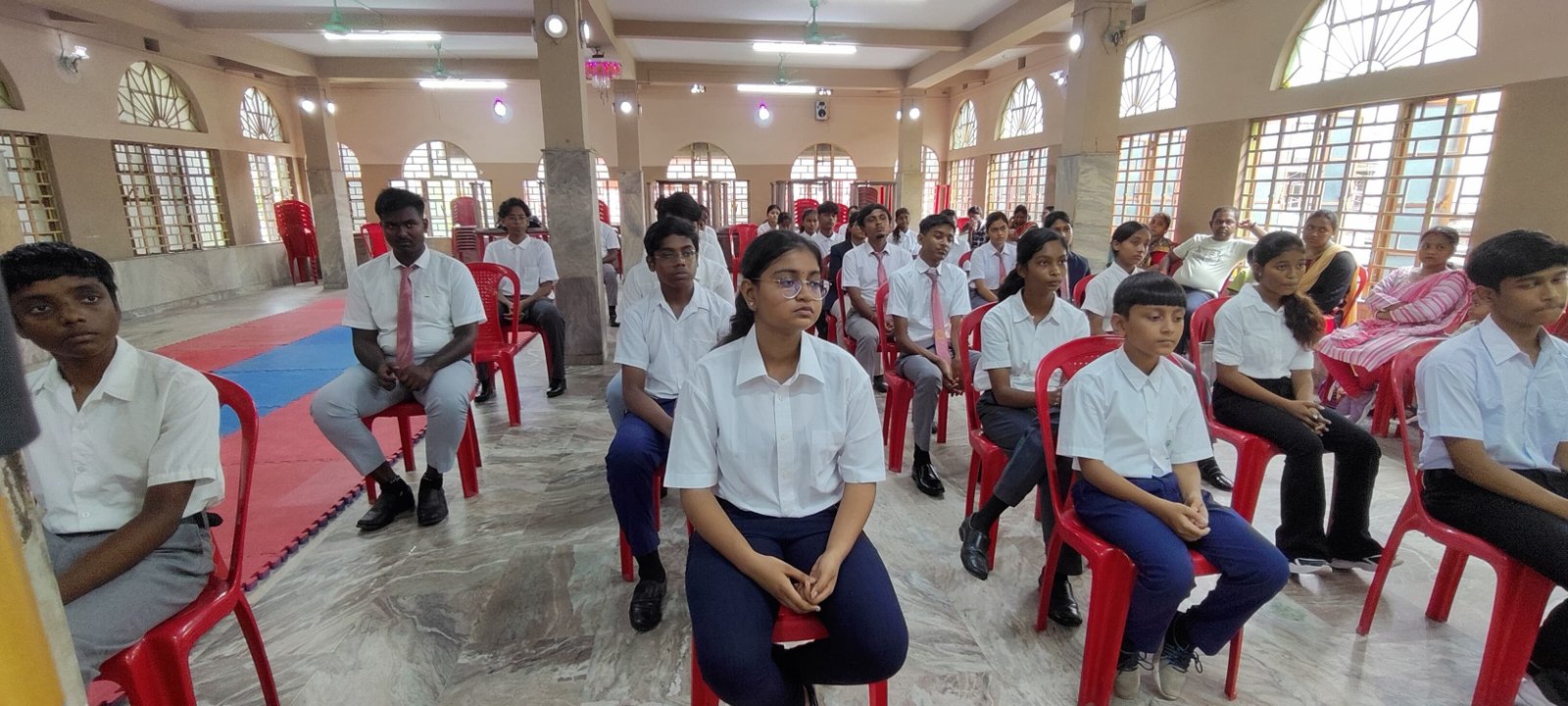 Another view of students seated for the briefing